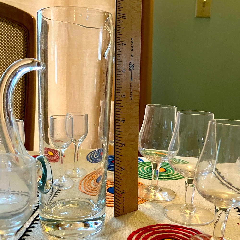 Glass pitcher with 4 brandy glasses and 6 small ones